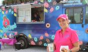 Owner Kerry McClure in front of her food truck, Rad Ringo's Mini-Donuts.