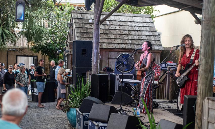 Local favorite duo, Bad Dog Mama playing for a crowd at the Colonial Oak Music Park on St. George Street