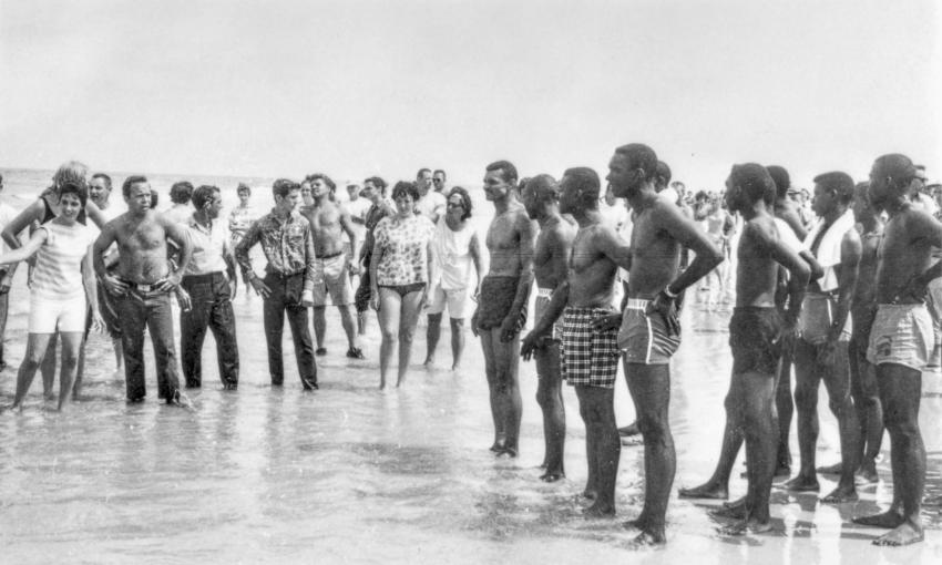 In the ankle deep water of St. Augustine Beach, activists (right) face off with segregationists on June 25 1964.