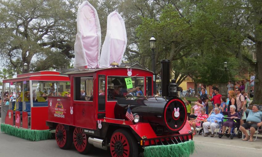 Ripley's Red Train sports a pair of giant bunny ears while giving a ride to several dignitaries in the Easter Parade