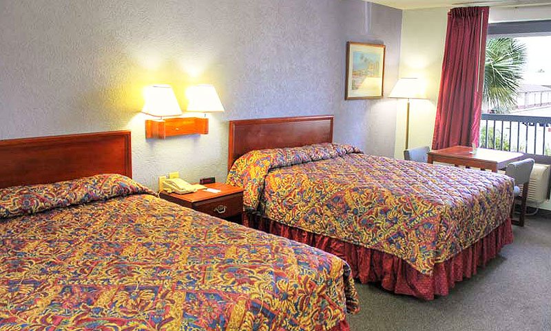 Two queen beds at a hotel room at the Regency Inn. Two queen beds at a hotel room at the Regency Inn.
