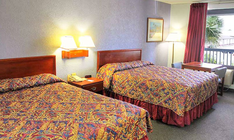 Two queen beds at a hotel room at the Regency Inn.