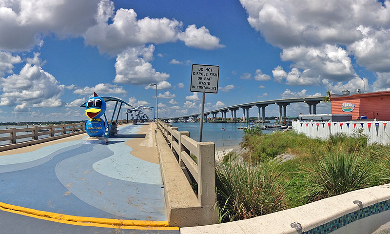 The whimsical statue of a bird greet visitors with the message, "Happiness is Vilano Beach, Florida."
